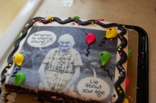 29 and Holding birthday cake